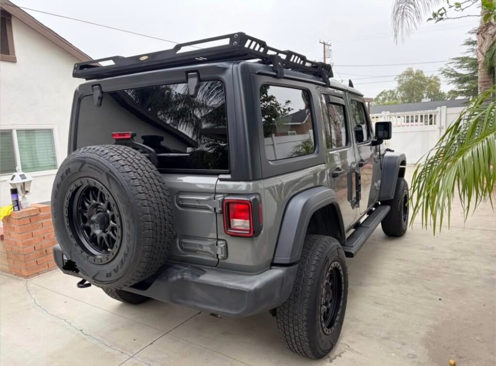 Grey Jeep Wrangler JLU 4-door Unlimited with roof rack – used OEM parts 2018-present